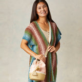 Peach Colored Shibori and Seagrass Bucket Bag - Model