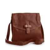 Beautifully handcrafted Fair Trade crossbody bag is made from soft matte leather exterior: Brown.  Printed interior with lots of pockets.